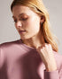 LIVANAA-Tops-Who says you can't be comfortable and chic? With a crew neck, long sleeves and embossed logo detail, LIVANAA is the staple sweatshirt that your wardrobe has been craving. Sweatshirt Embossed Ted Baker logo Crew neck Long sleeves Ayo is 5'8" / 1.73m and wears Red in a Ted size 1- Ted Baker Romania